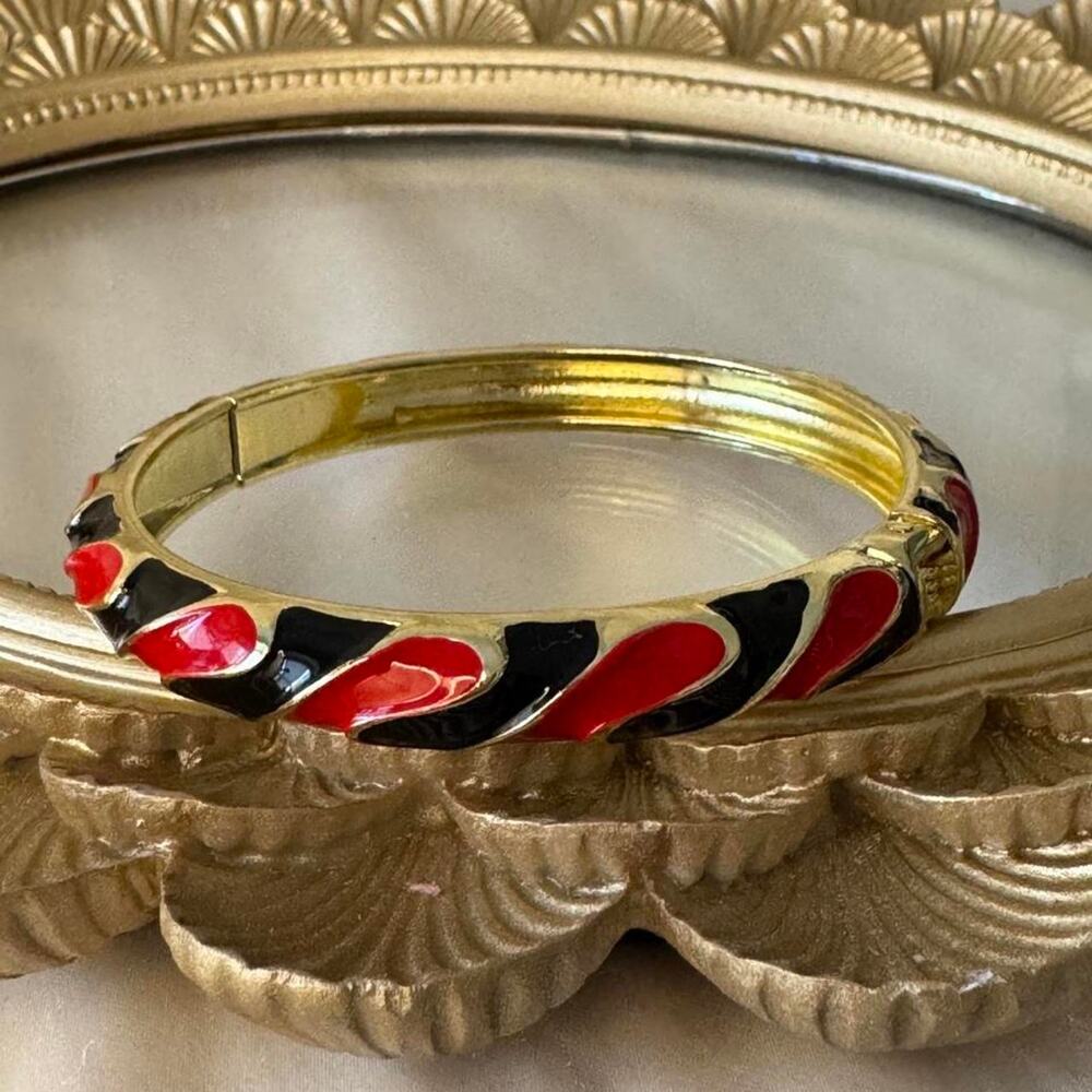 Gold red and black enamel